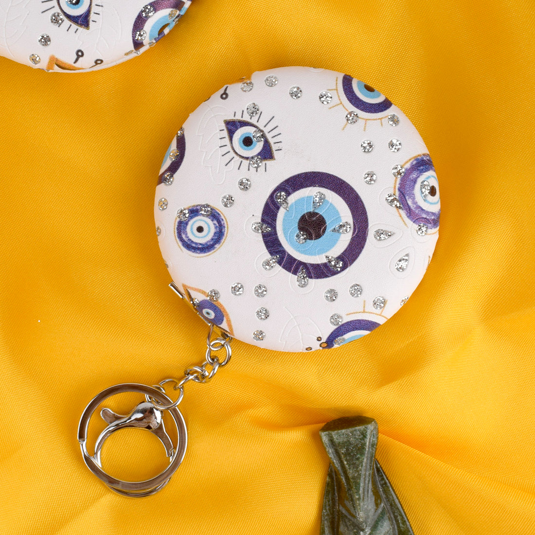 Round Evil Eye Keychain with Foldable Mirror – Stylish, practical, and protective keychain for everyday use. India’s Largest Pooja Accessories Brand – www.satvikstore.in