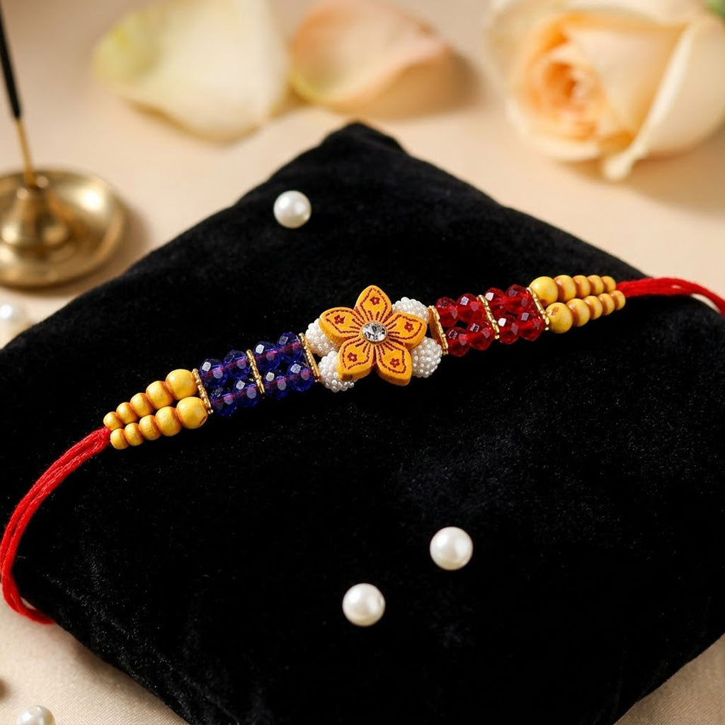 Vibrant Red Blue Crystal and Yellow Bead Wooden Floral Rakhi
