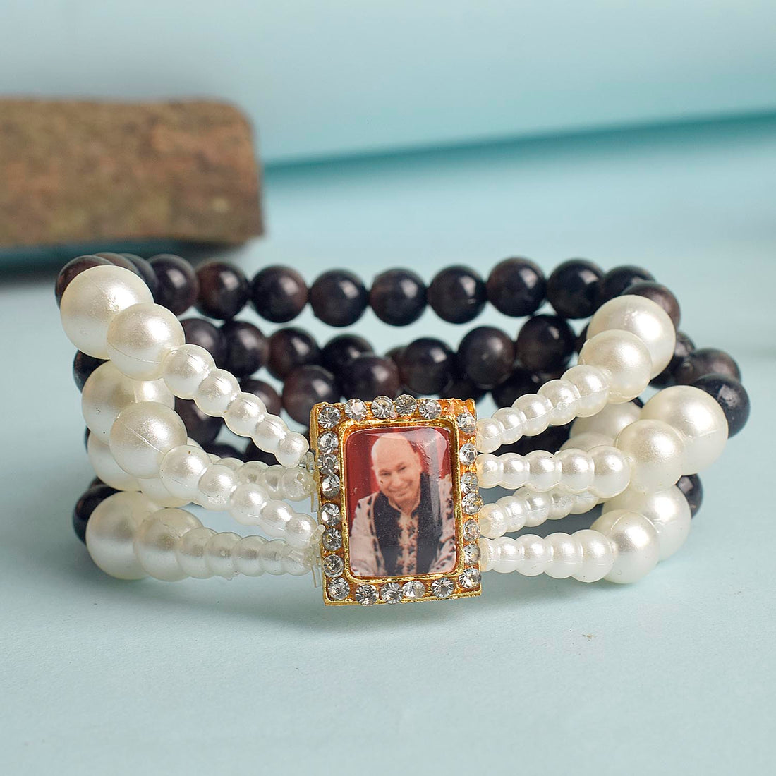 Black with White Pearl Four Layer Guruji Swaroop Bracelet featuring elegant black beads accented with luminous white pearls and Jai Guruji Swaroop – perfect for spiritual wear, festive gifting, and daily devotion. India’s Largest Pooja Accessories Brand – www.satvikstore.in
