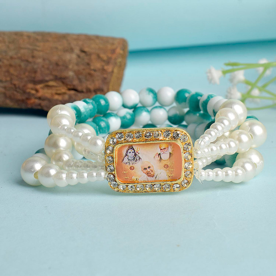 Bluish Green & White Marble Four Layer Guruji Swaroop Bracelet featuring tranquil bluish green beads and marble effect white beads with Jai Guruji Swaroop – perfect for spiritual wear, festive gifting, and daily devotion. India’s Largest Pooja Accessories Brand – www.satvikstore.in