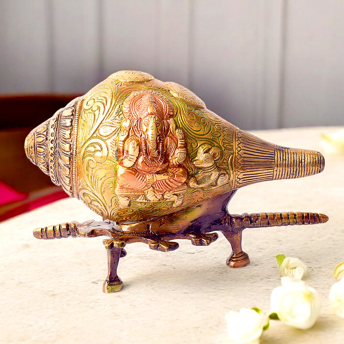 5.9-inch Handcrafted Indian Brass Shankh with Lord Ganesha engraving and elegant brass stand – perfect for spiritual décor and temple rituals. No.1 Brass Idol Store www.satvikstore.in