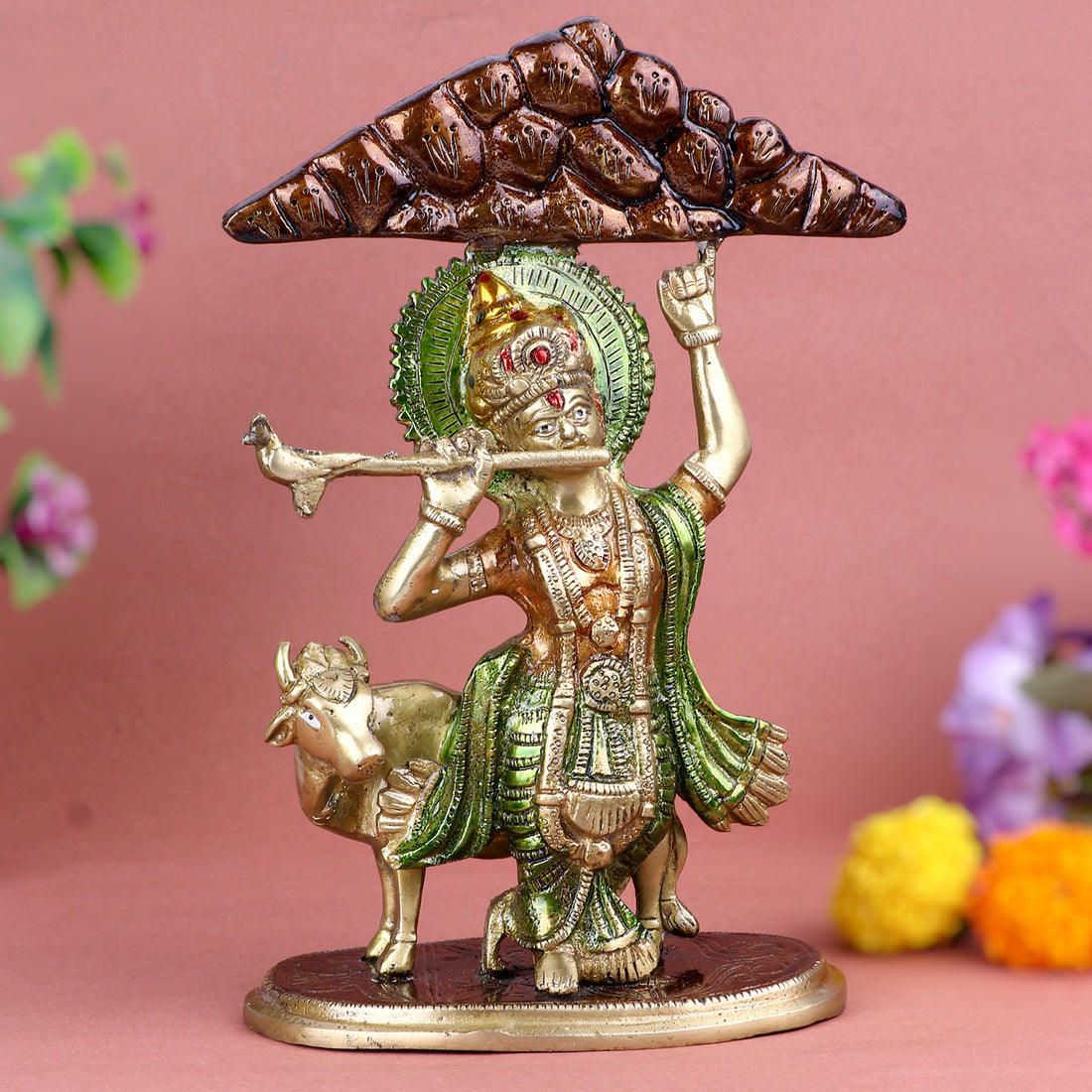 3.9 Inch intricately crafted Brass Krishna Idol depicting Lord Krishna lifting Mount Govardhan with one hand, symbolizing divine protection and strength, ideal for spiritual home décor and devotional worship. No.1 Brass Idol Store www.satvikstore.in