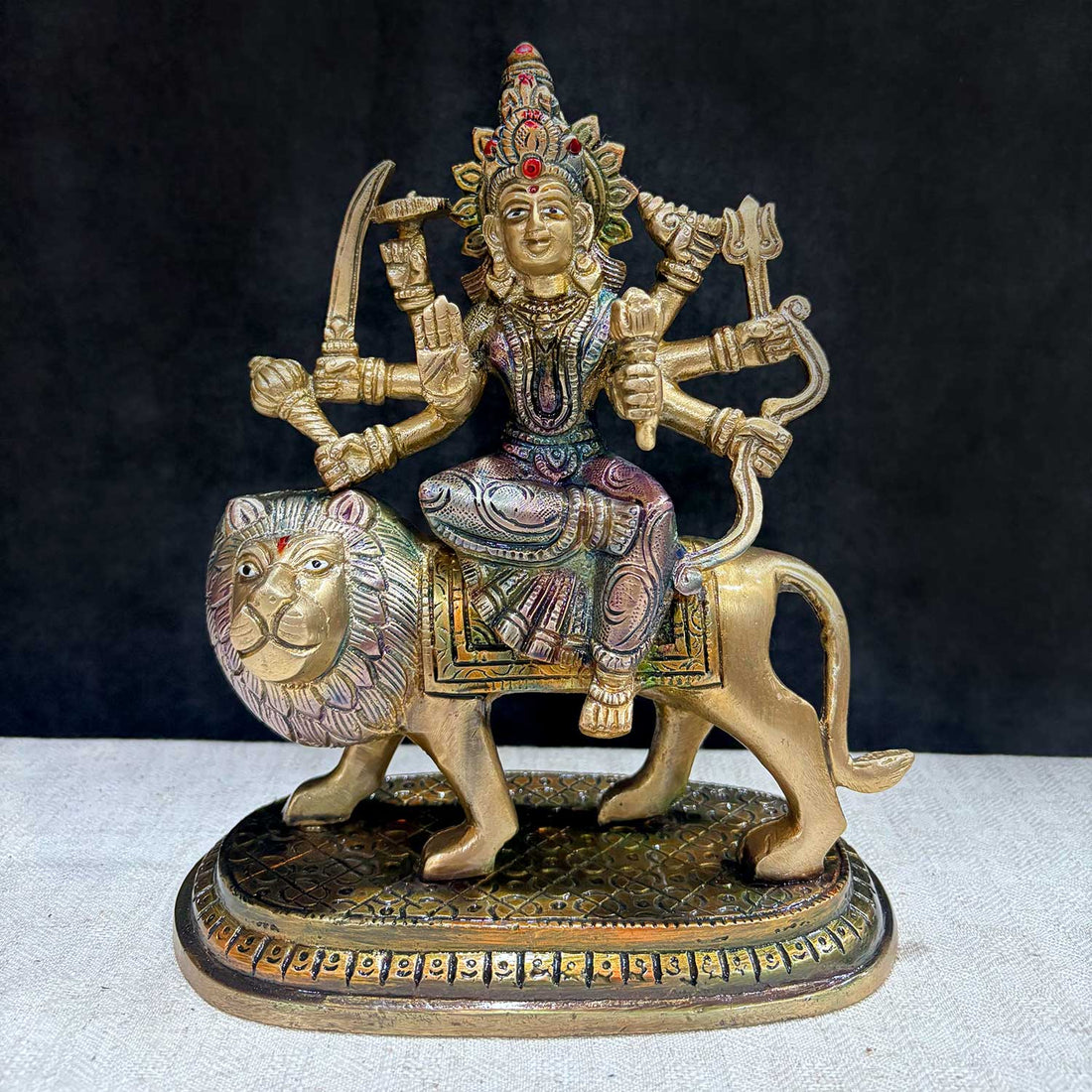 Embrace the powerful energy of Maa Durga with this 8.5-inch Brass 8-armed Durga Idol, beautifully depicted riding her mighty lion. This meticulously crafted statue showcases Maa Durga in her most majestic form, symbolizing strength, courage, and divine protection. No.1 Brass Idol Store www.satvikstore.in