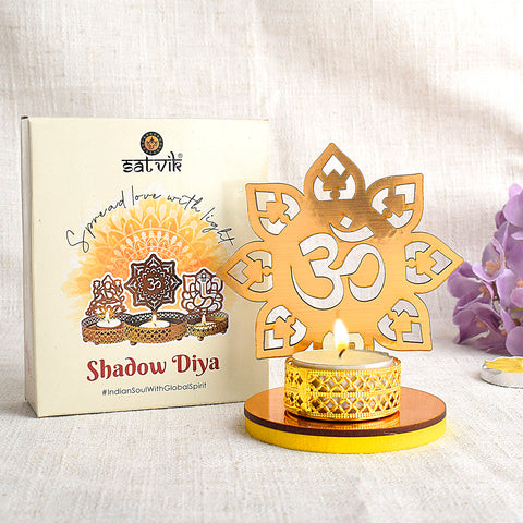 Designer OM Shadow Diya crafted in elegant metal, designed to cast a sacred "ΰ₯" shadow when lit, perfect for spiritual ambiance, meditation corners, and festive home dΓ©cor. Indiaβs Largest Pooja Accessories Brand β www.satvikstore.in