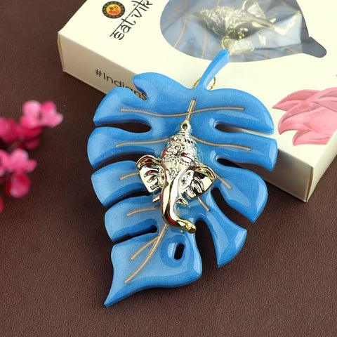 Elegant classic finish wall hanging featuring Lord Ganesha seated on a detailed leaf design, perfect for spiritual home decor and festive celebrations. Indiaβs Largest Pooja Accessories Brand β www.satvikstore.in