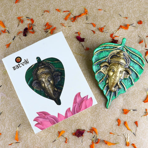 1 Pc Lord Ganesh Face on Leaf Patta Wall Hanging Green β Beautiful green leaf-shaped wall hanging with Lord Ganeshaβs face embossed for spiritual and decorative home appeal. Indiaβs Largest Pooja Accessories Brand β www.satvikstore.in