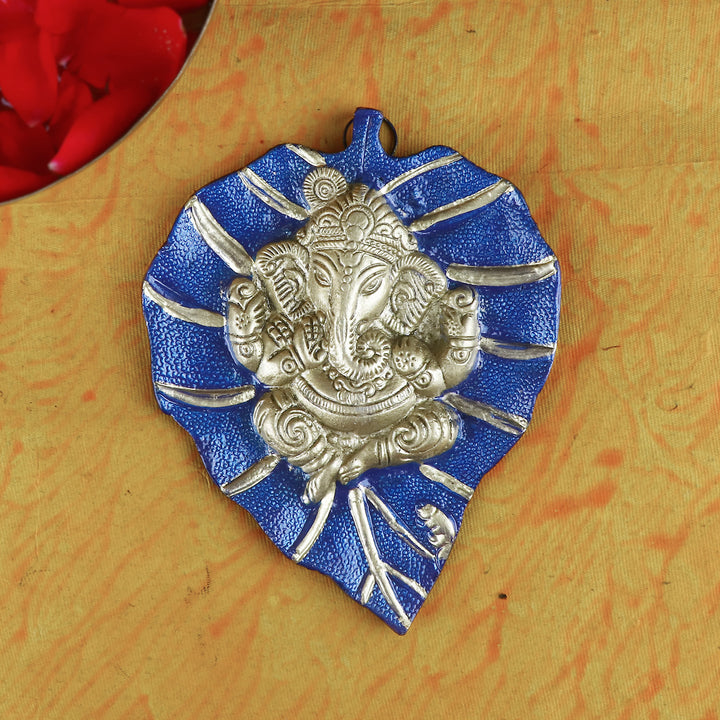 Blue wall hanging featuring Lord Ganesha seated on a detailed leaf (patta) design, ideal for spiritual home decor and gifting. Indiaβs Largest Pooja Accessories Brand β www.satvikstore.in