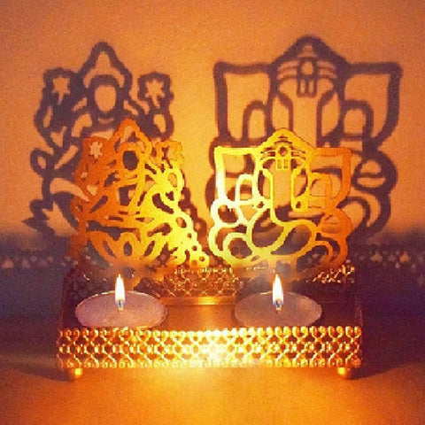 Decorative Lord Ganesh and Goddess Lakshmi Shadow Diya crafted in metal, radiating divine silhouettes of Ganpati and Lakshmi when litβperfect for Diwali, pooja room, or spiritual gifting. Indiaβs Largest Pooja Accessories Brand β www.satvikstore.in