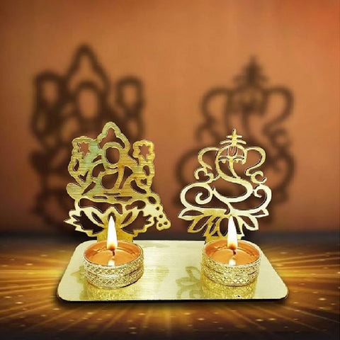 Decorative Lord Ganesha and Lakshmi Shadow Diya, a beautifully crafted metal lamp featuring the divine images of Lord Ganesha and Goddess Lakshmi, casting elegant shadows when lit. Ideal for festive occasions, puja ceremonies, and home decor. Indiaβs Largest Pooja Accessories Brand β www.satvikstore.in