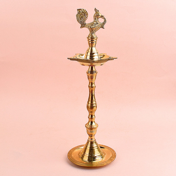 13.5 Inch Brass Peacock Kerala Diya – Handcrafted brass diya featuring an intricate peacock motif, ideal for grand pooja rituals, temple lighting, and traditional décor. India’s Largest Pooja Accessories Brand – www.satvikstore.in