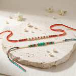 Traditional Pearl and Crystal Beaded Rakhi (Set of 2)