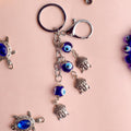 3 Tier Buddha Keychain with Evil Eye – A spiritual and protective charm for keys, bags, or gifts. India’s Largest Pooja Accessories Brand – www.satvikstore.in