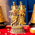  This Stunning Radha Krishna Brass Idol beautifully captures the divine love and grace of Radha and Krishna. Crafted from high-quality brass with intricate detailing, it exudes elegance and spiritual charm. 