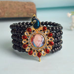 Black Beads Five Layer Guruji Swaroop Bracelet featuring a regal peacock-shaped pendant with Jai Guruji Swaroop – perfect for spiritual wear, meditation, and gifting. India’s Largest Pooja Accessories Brand – www.satvikstore.in