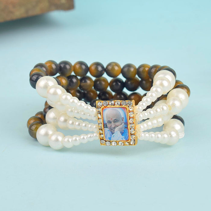 Black & Yellow with White Pearl Four Layer Guruji Swaroop Bracelet featuring striking black and yellow beads accented with luminous white pearls and Jai Guruji Swaroop – perfect for spiritual wear, festive gifting, and daily devotion. India’s Largest Pooja Accessories Brand – www.satvikstore.in