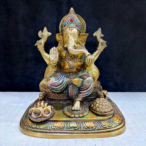The "9.1 Inch Sacred Ganesh Idol" is a beautifully crafted statue of Lord Ganesha, symbolizing wisdom, success, and the removal of obstacles. Standing at 9.1 inches tall, it features intricate detailing and traditional attributes like the axe, lotus, and modak.India's Largest Puja Accessories Brand - Satvik No. 1 Brass Idol Collection.
