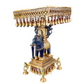  Large Brass Idol of 23 Inch Brass Chowki on Elephant with Hanging Bells. This 23 Inch Brass Chowki on Elephant with Hanging Bells is a stunning blend of artistry and tradition. Crafted from high-quality brass, the intricate detailing of the elephant and the delicately suspended bells add a touch of elegance to any space. 