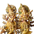 This Lovely Radha Krishna with Cow Colorful Brass Idol beautifully portrays the divine love and grace of Radha and Krishna, accompanied by the sacred cow. Handcrafted from high-quality brass and adorned with vibrant colors, this idol exudes spiritual charm and elegance.