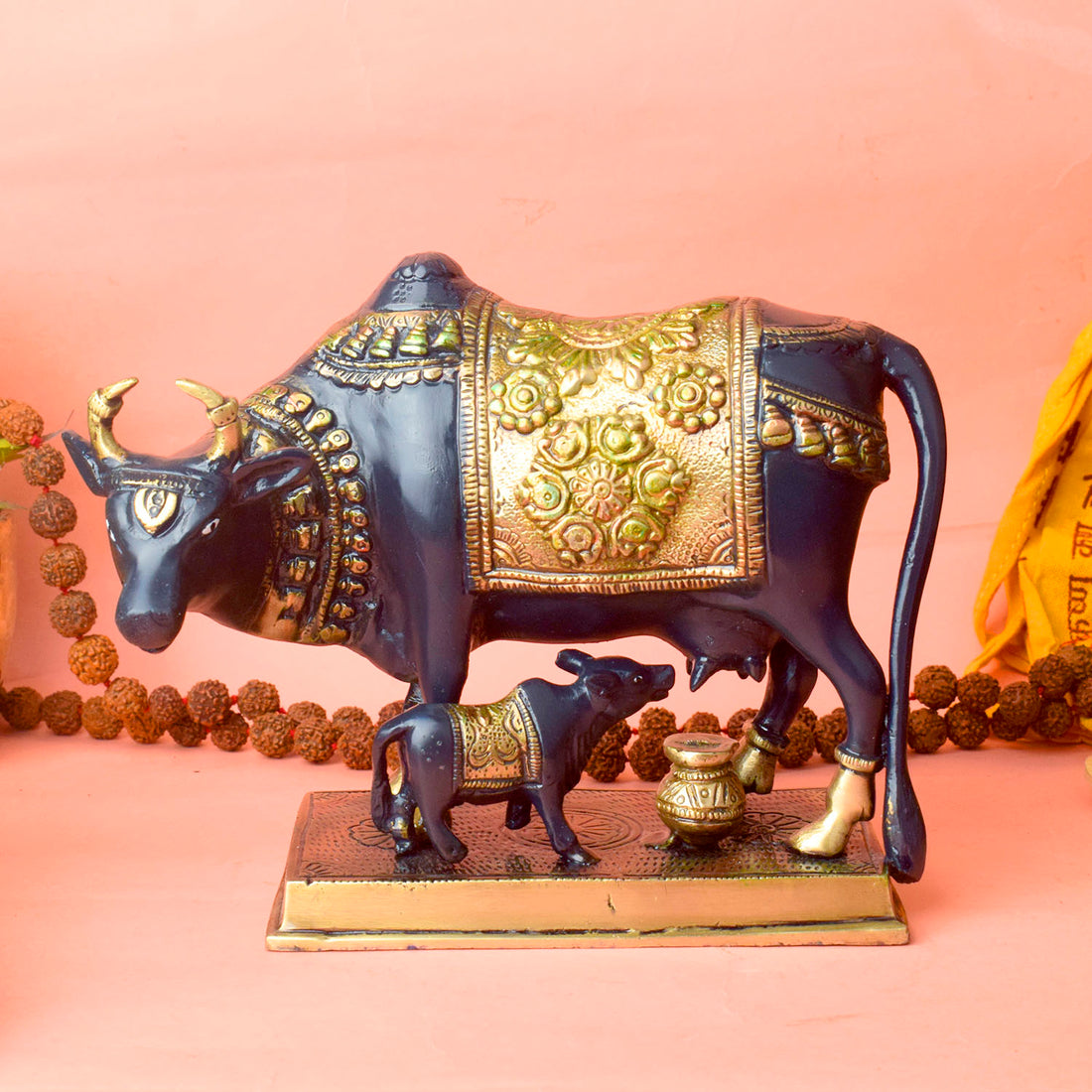 This 6.7-inch Kamdhenu cow figurine is a beautiful representation of purity, prosperity, and spiritual blessings. Known as the divine cow in Hindu mythology, Kamdhenu is believed to grant every wish and bring abundance to its devotees. Crafted with intricate details, this figurine exudes a sense of holiness and serenity.