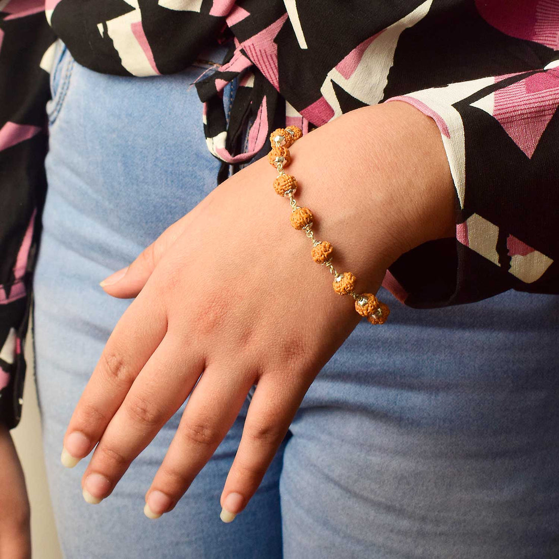Certified Natural Rudraksha Bracelet with silver capping featuring peach beads for spiritual protection and daily wear. India’s Premium Rudraksha Jap Mala Store- www.satvikstore .in
