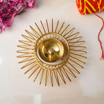 Gold-toned decorative Akhand Sun Shape Brass Diya featuring a radiant Surya (sun) motif and eternal flame chamber, ideal for spiritual lighting and festive décor. India’s Largest Pooja Accessories Brand – www.satvikstore.in