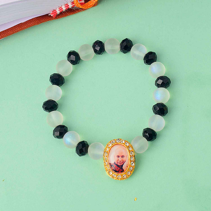 Guruji Swaroop Bracelet with elegant white and black beads – spiritual bracelet for pooja, gifting, satsangs, and daily wear. Satvikstore.in