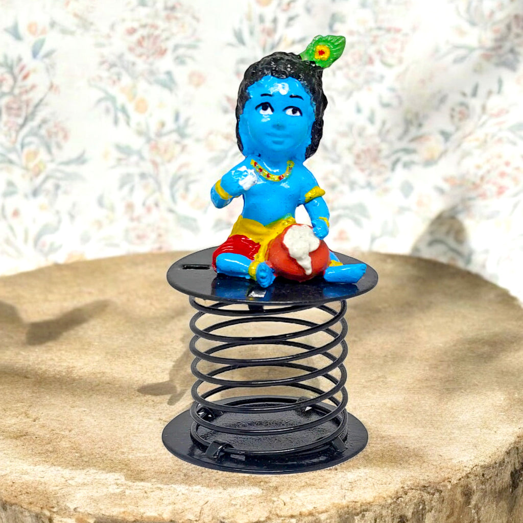 Laddu Gopal idol, beautifully crafted to depict Lord Krishna in his charming childhood form, holding a laddu, symbolizing joy, devotion, and divine blessings. India’s Largest Pooja Accessories Brand – www.satvikstore.in 