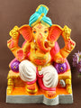 Graceful 13.3-inch Manomay eco-friendly Ganesha idol seated in regal Raja pose with vibrant detailing and a majestic crown, perfect for eco-conscious Ganesh Chaturthi celebrations. India’s Largest Pooja Accessories Brand – www.satvikstore.in