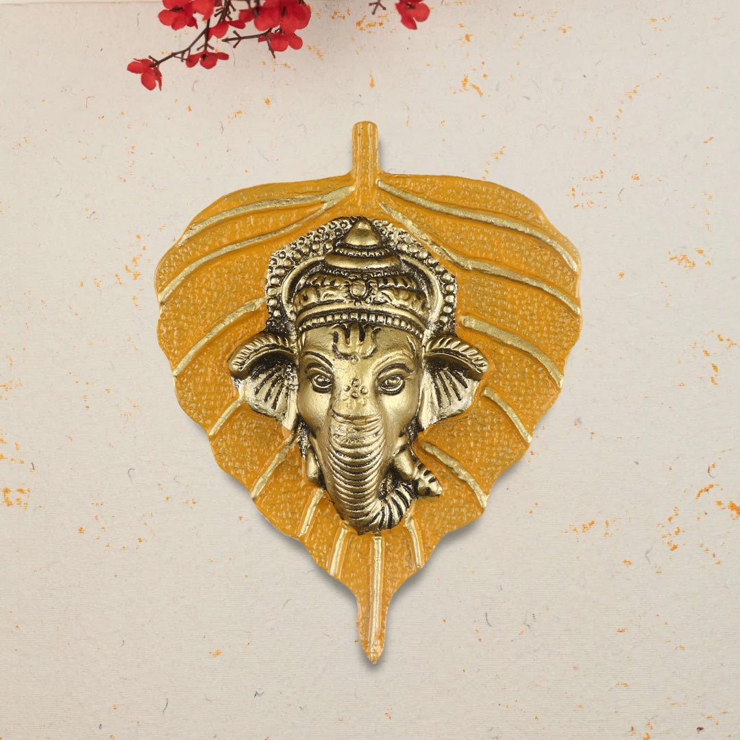 1 Pc Lord Ganesh Face on Leaf Patta Wall Hanging Yellow