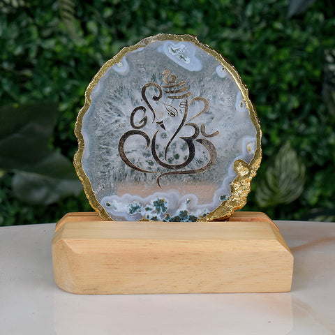 Spiritual Agate Ganesha Display Stand featuring a finely hand-painted Lord Ganesha image on a natural agate stone slice, mounted on a sturdy metal stand for sacred and elegant home decor. India’s Largest Pooja Accessories Brand – www.satvikstore.in